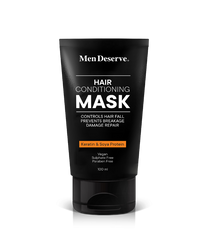 A black tube of MenDeserve hair conditioning mask with white and orange text highlighting the product's benefits like controlling hair fall, nourishing, and promoting hair growth.