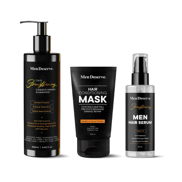 A set of Men Deserve hair care products including a shampoo, conditioner, and hair serum, packaged in black bottles with white and orange labeling.