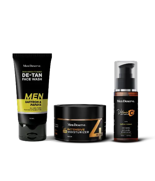 A set of men's skincare products including a de-tan facewash, moisturizer, and vitamin C serum