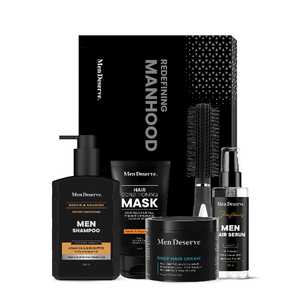 A collection of men's hair care products including shampoo, hair mask, hair serum, hair cream, and a hair comb, all packaged in black and white branded containers.