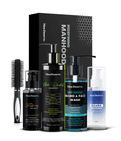 A men's grooming kit including beard softener, beard and face wash, anti-dandruff shampoo, daily strengthening hair serum, and a round hair brush with soft nylon bristles, all packaged in a black box with the brand name 'Mendeserve'.