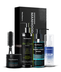A Men Grooming Kit containing shampoo, hair cream, beard and face wash, beard softener, and a round hair brush, all packaged in black and blue bottles and a box with the brand name 'Men Deserve'.