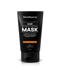 A black tube of MenDeserve hair conditioning mask with white and orange text highlighting the product's benefits like controlling hair fall, nourishing, and promoting hair growth.