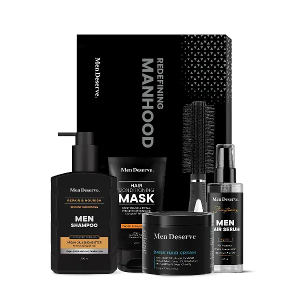 A collection of men's hair care products including shampoo, hair mask, hair serum, hair cream, and a hair comb, all packaged in black and white branded containers.