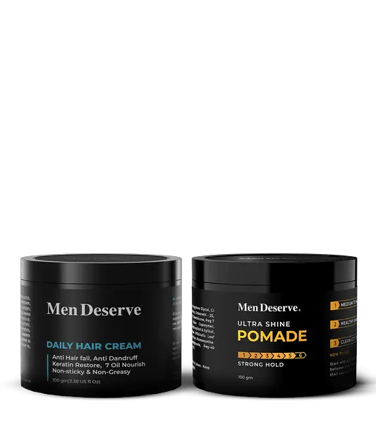 Two containers of hair care products, one labeled as 'MEN DESERVE DAILY HAIR CREAM' and the other as 'MEN DESERVE ULTRA SHINE POM ADE'. Both containers are black and have white and orange text on them.
