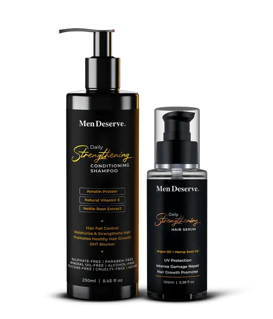 Two bottles of Men Deserve hair care products, a shampoo and a serum, with a pump dispenser, black in color, with text indicating 'Daily Strengthening Conditioning Shampoo' and 'Daily Strengthening Hair Serum'.