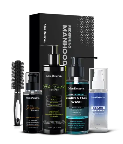 A men's grooming kit including beard softener, beard and face wash, anti-dandruff shampoo, daily strengthening hair serum, and a round hair brush with soft nylon bristles, all packaged in a black box with the brand name 'Mendeserve'.