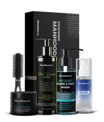 A Men Grooming Kit containing shampoo, hair cream, beard and face wash, beard softener, and a round hair brush, all packaged in black and blue bottles and a box with the brand name 'Men Deserve'.